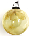Lemon coloured glass bauble with flowers inside